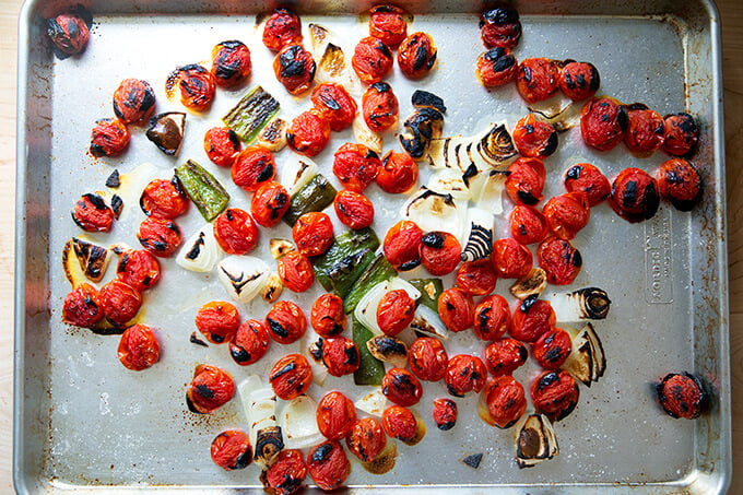 Broiled vegetables on a sheet pan.