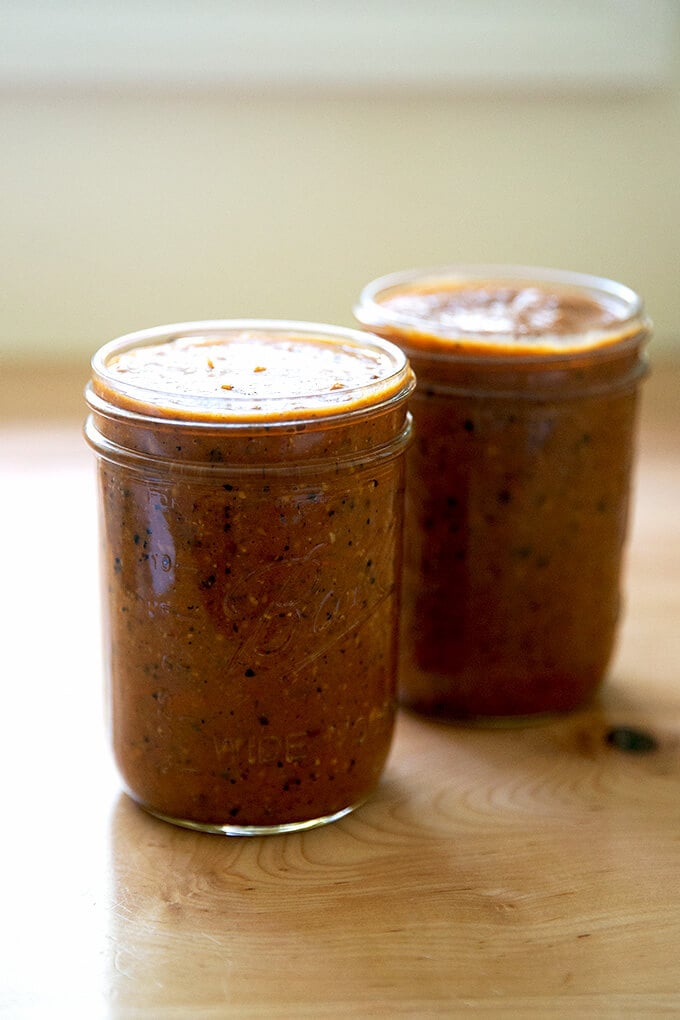 Two jars of homemade fresh enchilada sauce. 