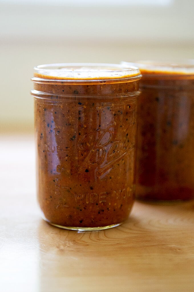 Two jars of homemade fresh enchilada sauce. 