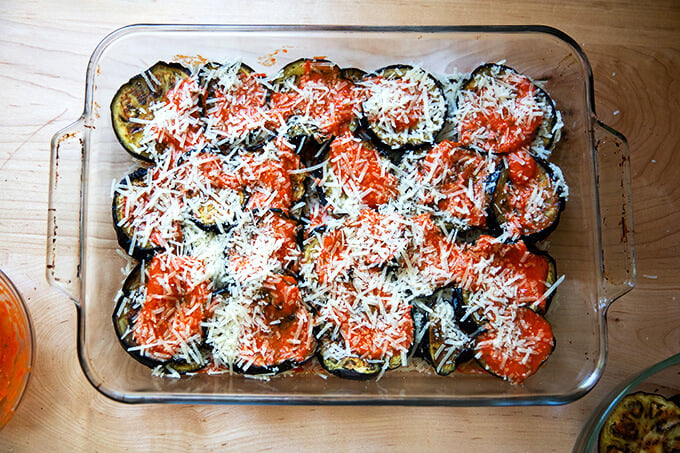 A 9x13-inch pan filled with unbaked eggplant parmesan.