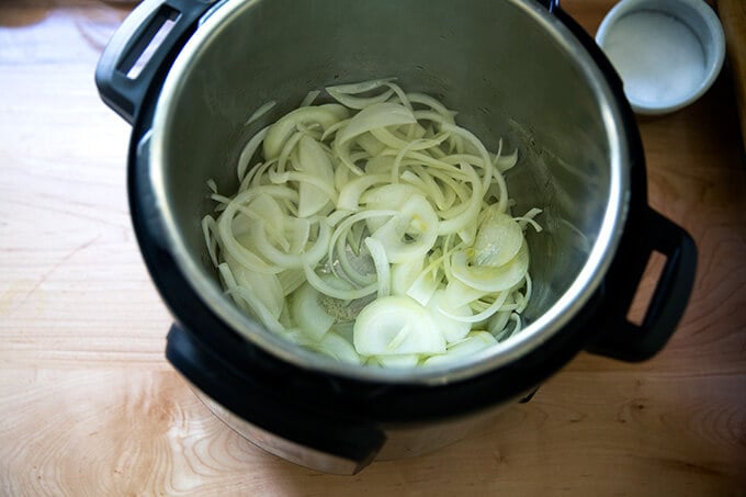 An Instant Pot filled with sautéed onions.
