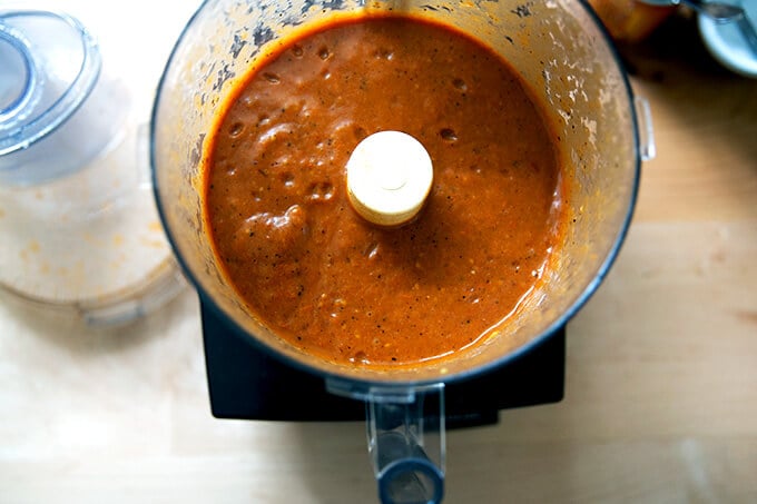 Puréed enchilada sauce in a food processor.