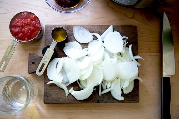 A board with sliced onions.