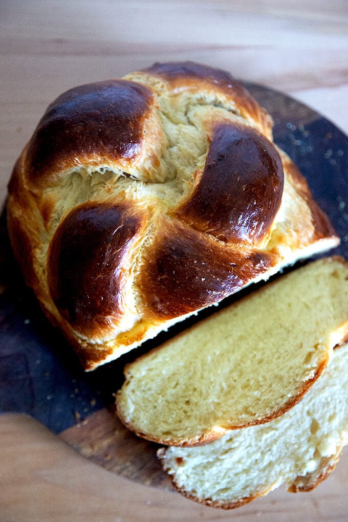 Sliced challah on a board.