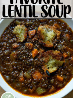 A bowl of lentil soup with olive oil crumbs.