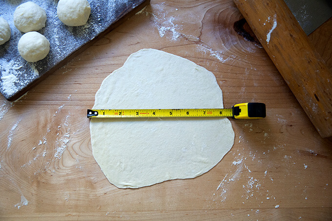 A sourdough flour tortilla rolled out to 8 inches wide.