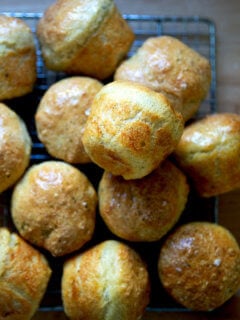 Thyme dinner rolls on a cooling rack.