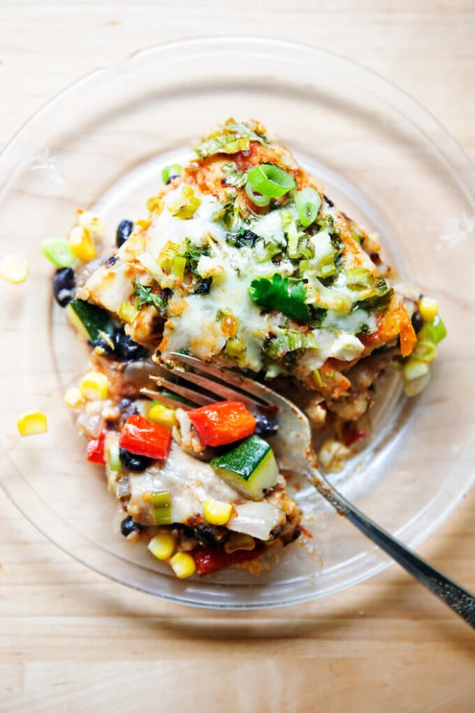 A piece of vegetarian tortilla casserole on a plate.