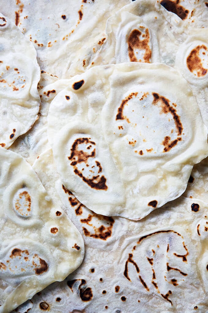 A counter covered with sourdough flour tortillas.