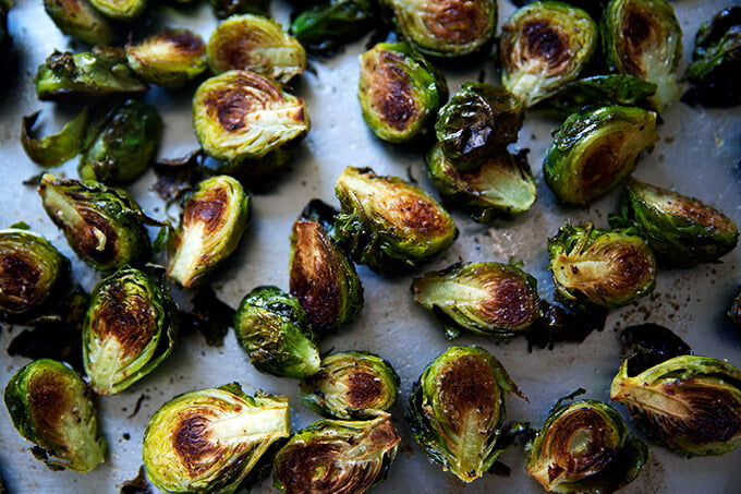 Roasted Brussels sprouts on a sheet pan.