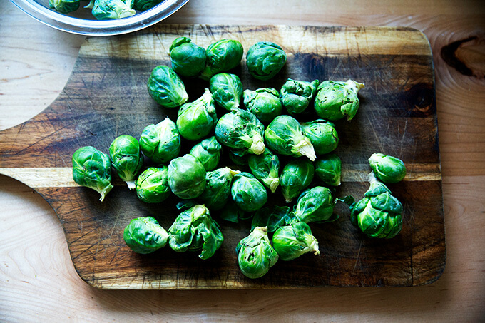 Brussels sprouts on a cutting board.