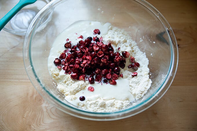 Adding the cranberries to the scone dough.