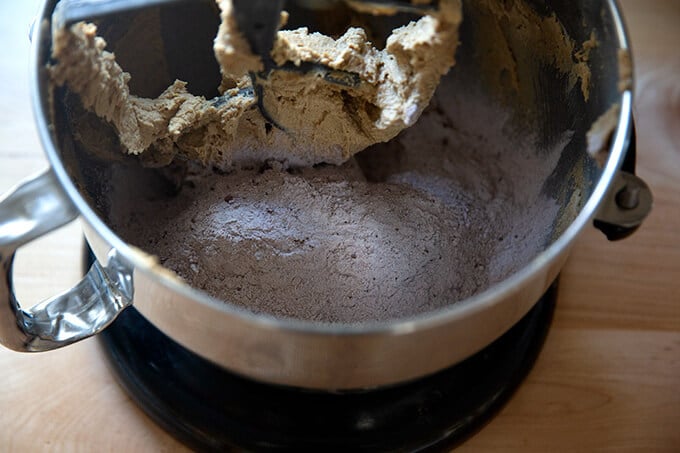 Adding the dry ingredients to the stand mixer.