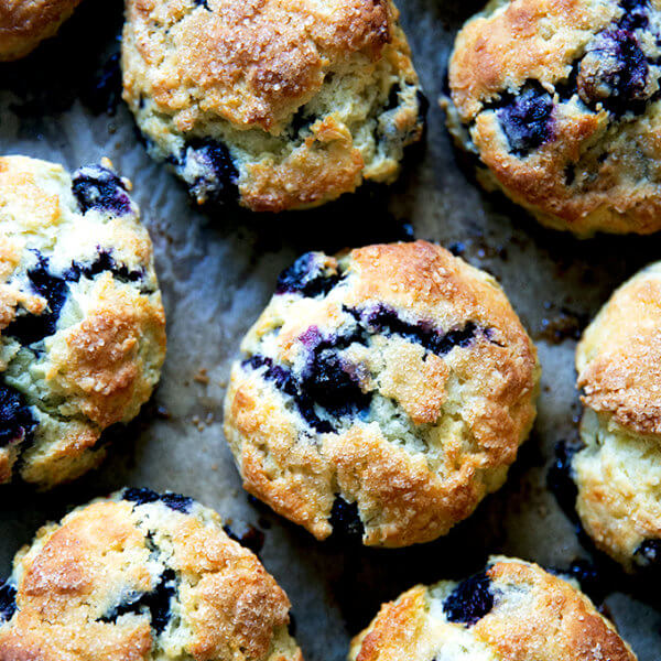 Just-baked Blueberry Scones on a sheet pan.