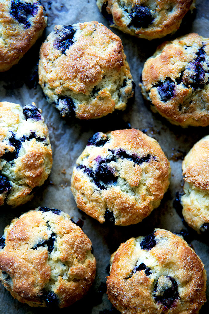 Just-baked Blueberry Scones on a sheet pan.