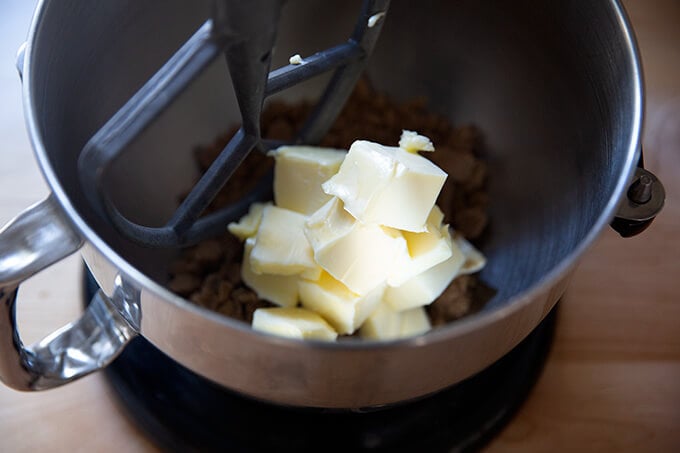 Butter and brown sugar in the bowl of a stand mixer.