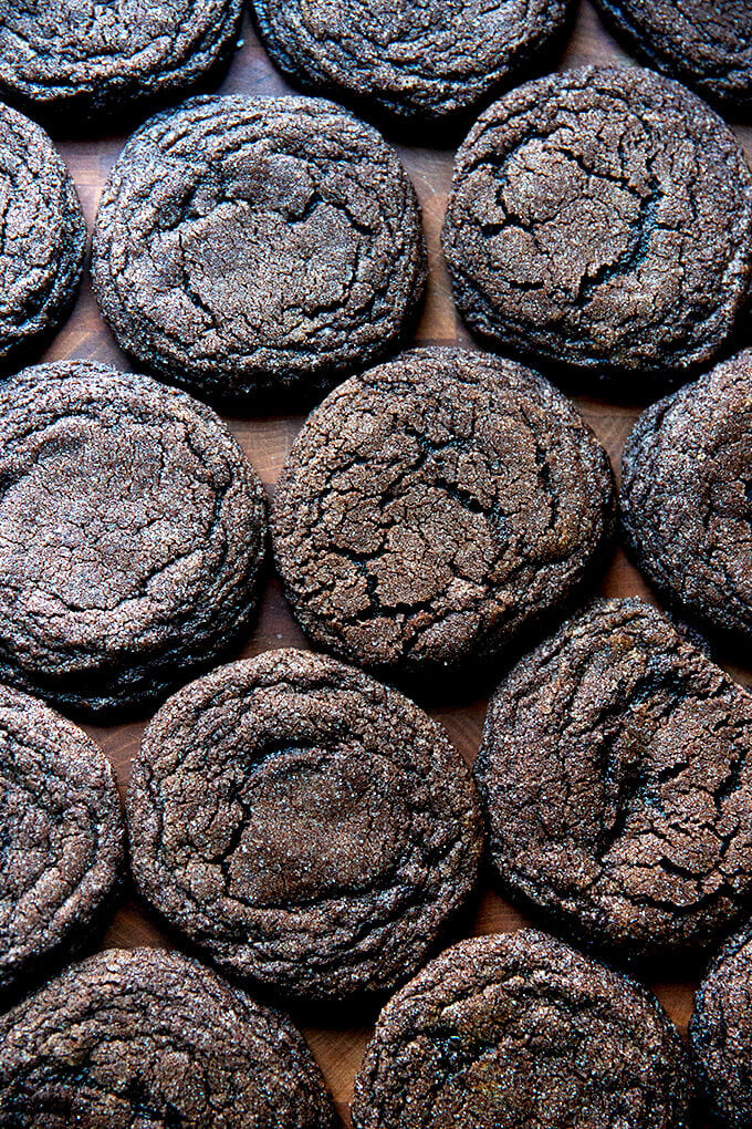 Baked chocolate sugar cookies on a board.