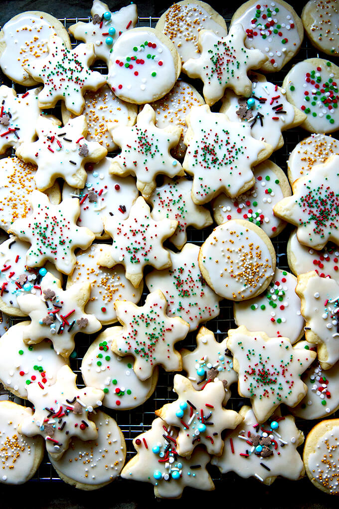 Decorated Christmas cookies on a cooling rack.