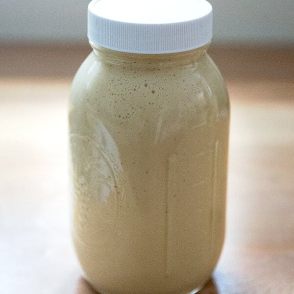 A large jar of tahini dressing.