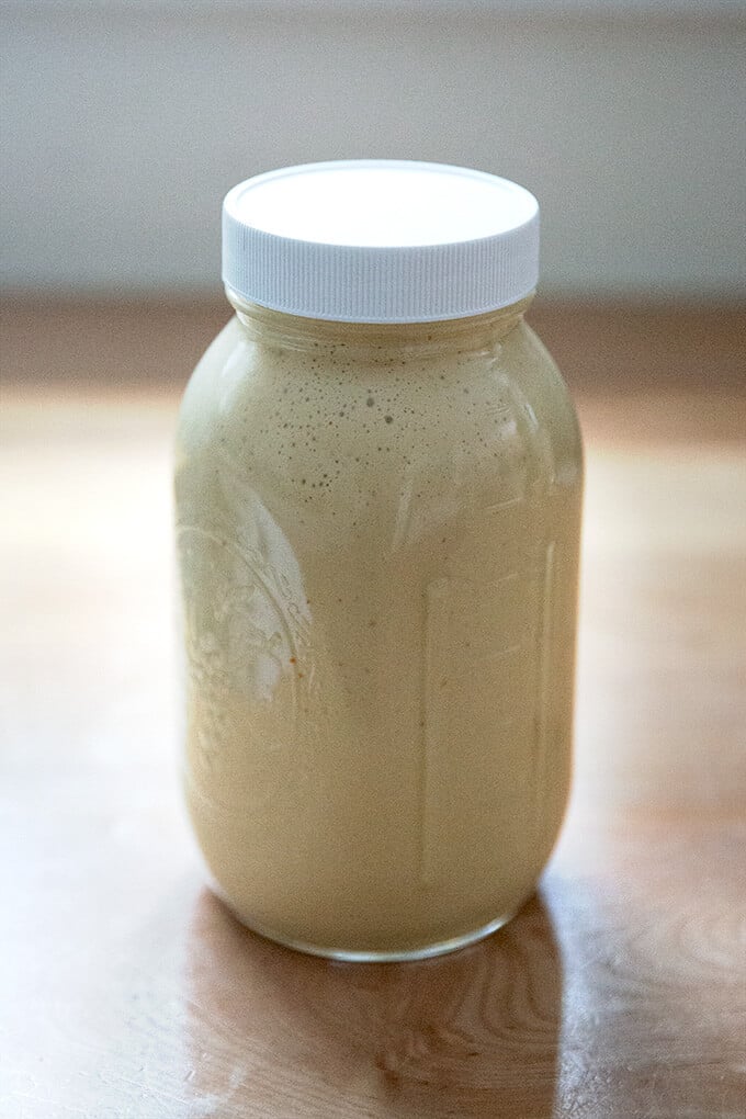 A large jar of tahini dressing.