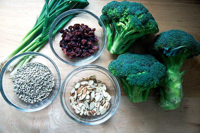 Ingredients for broccoli salad on countertop.