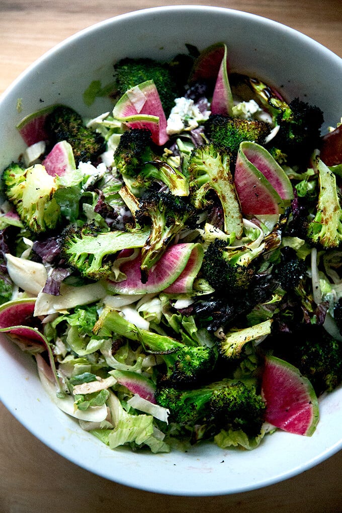 A large chopped salad tossed with tahini dressing.