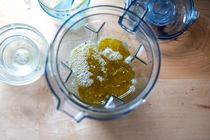 Ingredients for salad dressing in a blender.