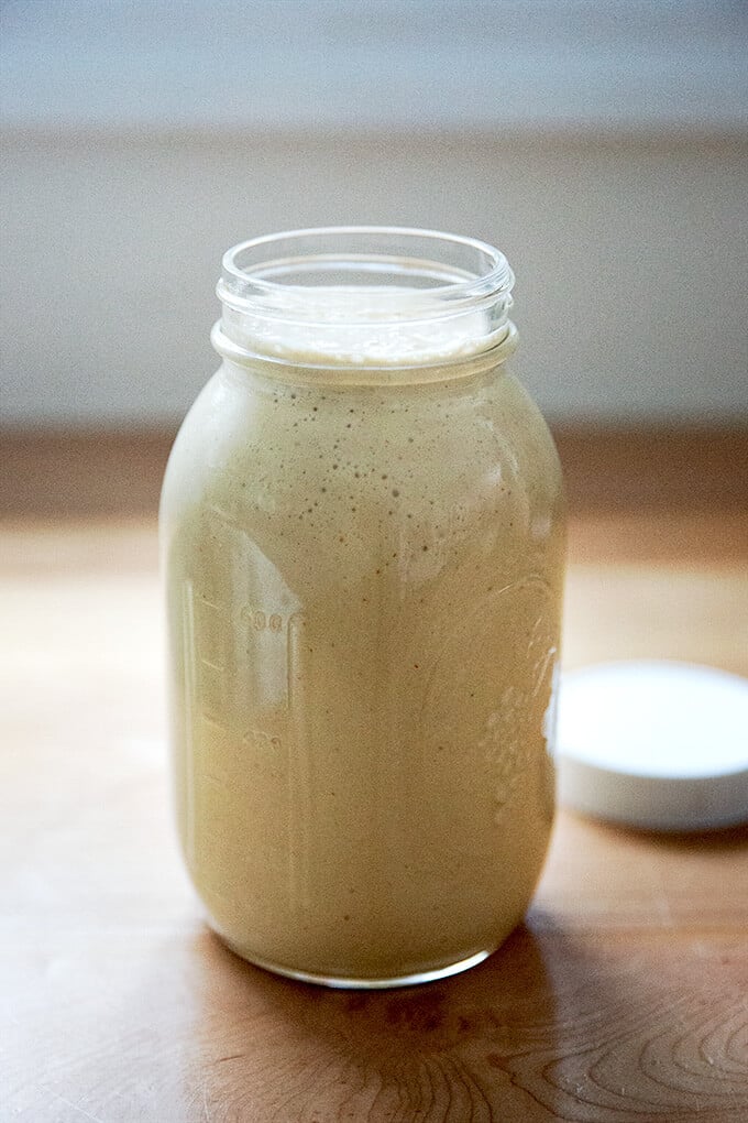 A large jar of tahini salad dressing.