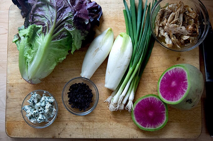 Ingredients on a board for a chopped salad.