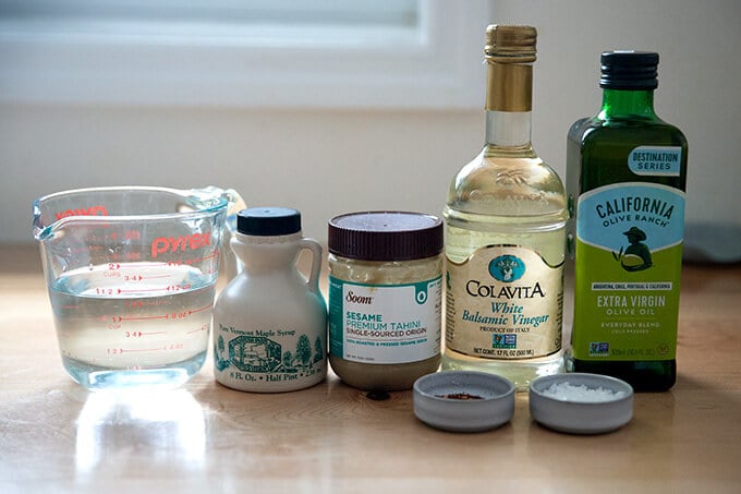 Ingredients to make tahini dressing on a counter top.