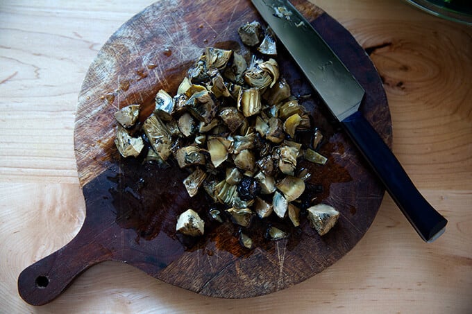Coarsely chopped artichoke hearts.