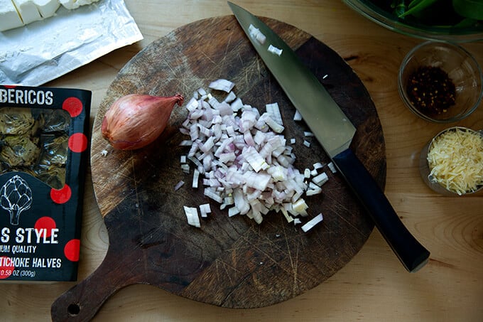 Diced shallots on a board.