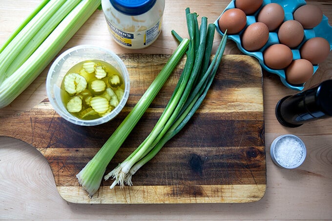 Ingredients on a board to make egg salad.