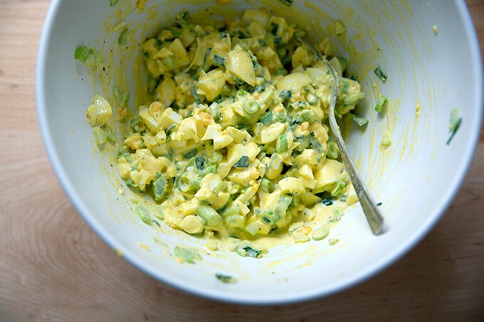 Mixed egg salad in a board.