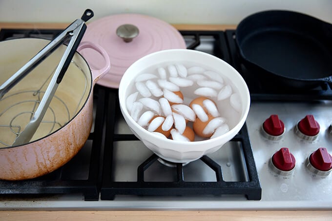 Steamed eggs in an ice bath.