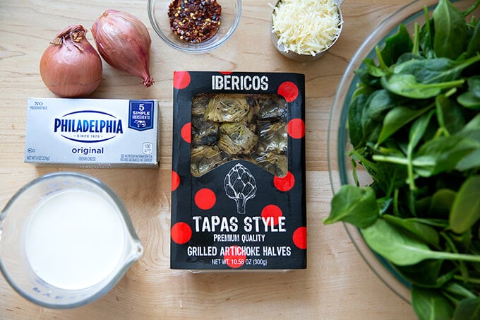 Ingredients to make spinach artichoke dip.