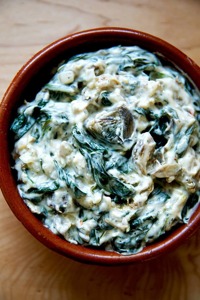 A small dish filled with spinach-artichoke dip.