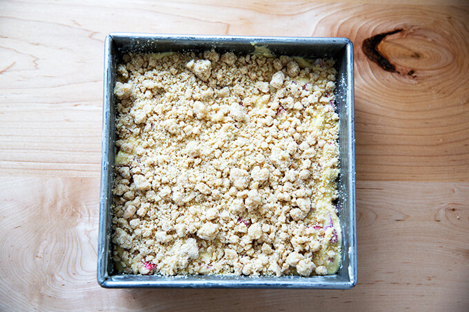 Adding the crumb topping to the rhubarb buckle.