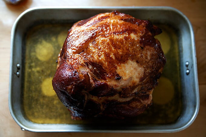 A glazed whole roasted bone-in ham.
