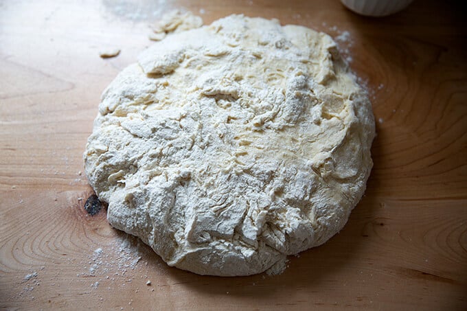 Brioche dough turned out onto a countertop.