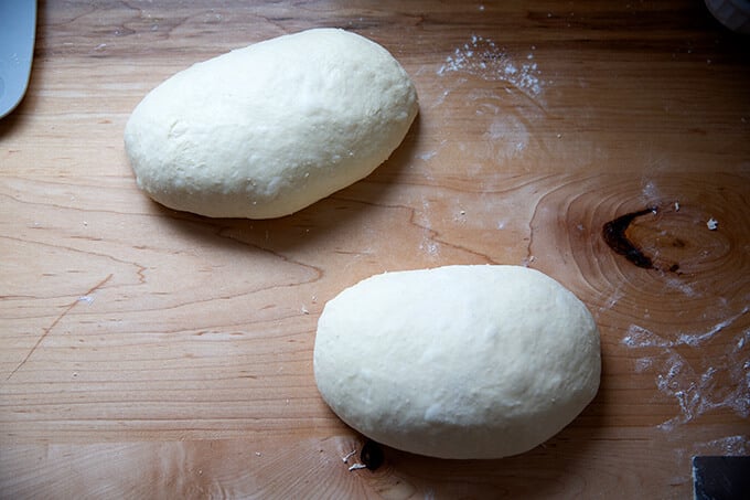 Shaped brioche loaves on a countertop.