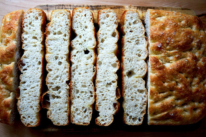 Sliced focaccia on a board.