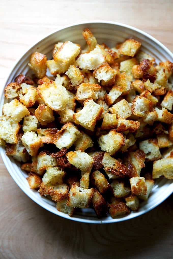 Olive oil croutons in a bowl.