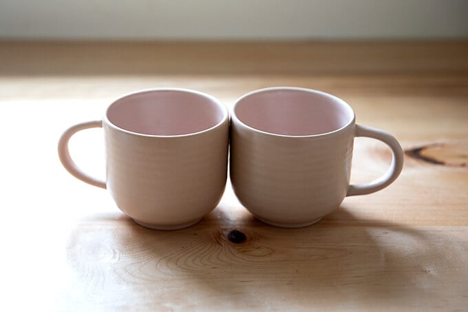 Two pink mugs.