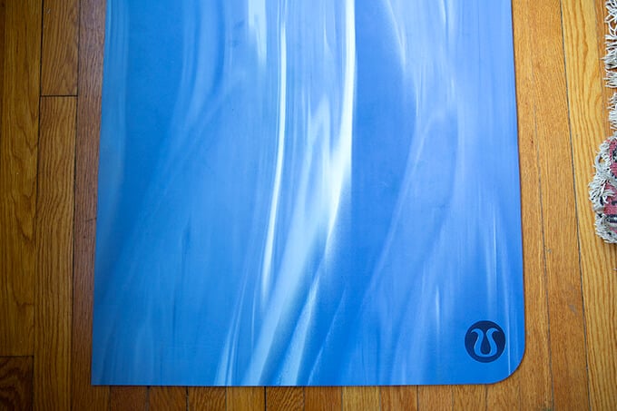 A blue Lululemon yoga mat.