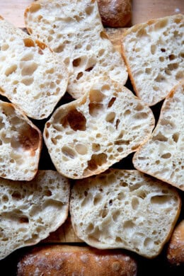 A pile of halved ciabatta rolls.