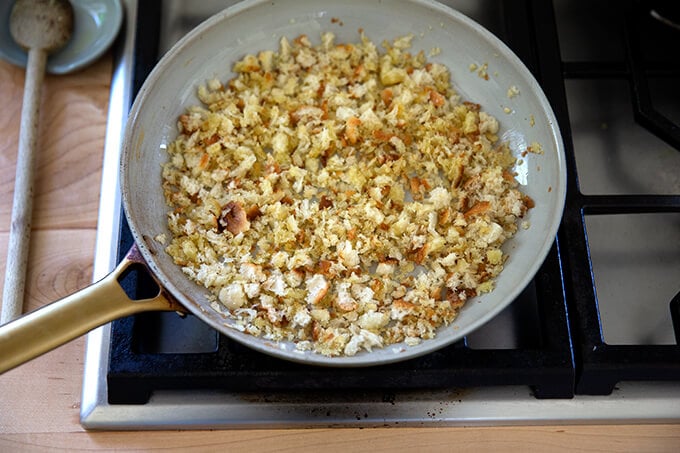 Toasty bread crumbs in a skillet.