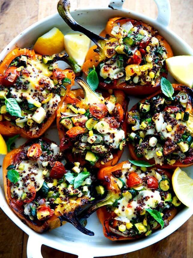 Veggie loaded stuffed bell peppers on a platter. 