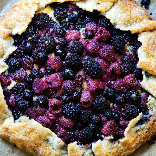 Mixed berry galette on a sheet pan.