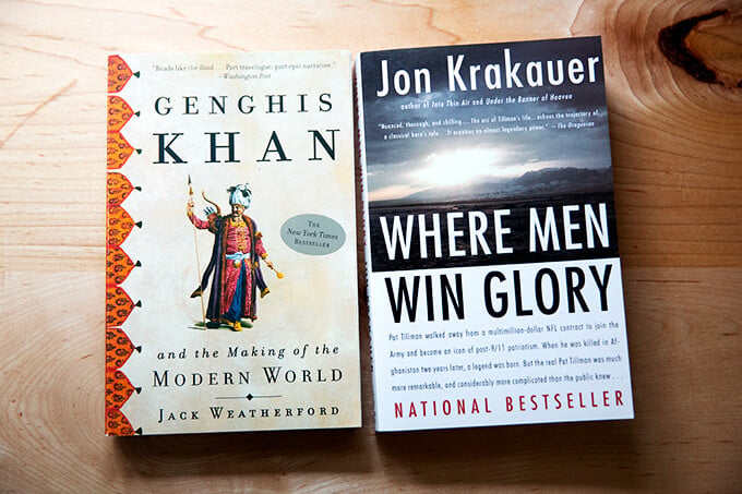 Two books on a counter: Genghis Khan and Where Men Win Glory